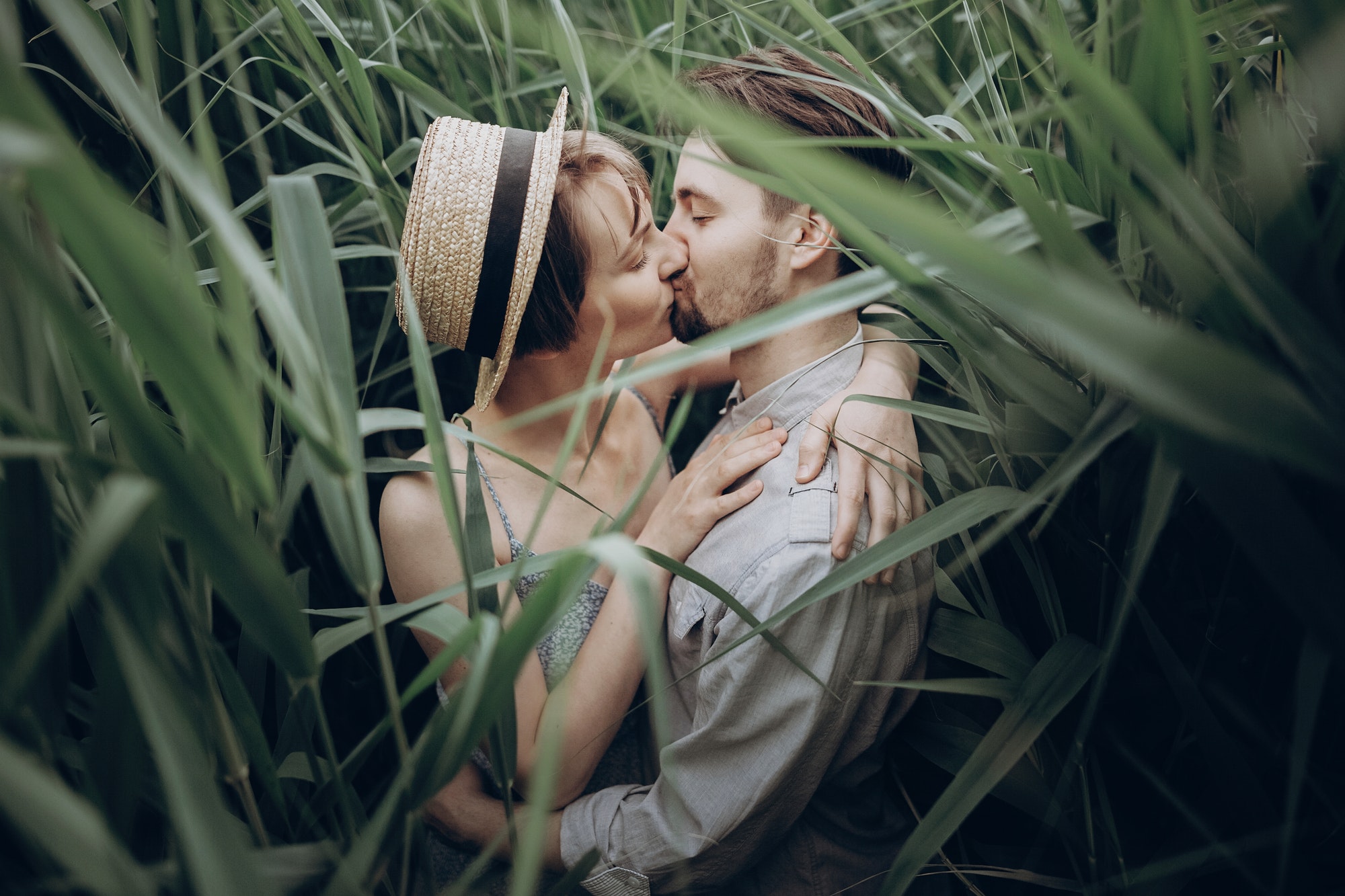 happy hipster couple embracing at lake in cane.jpg