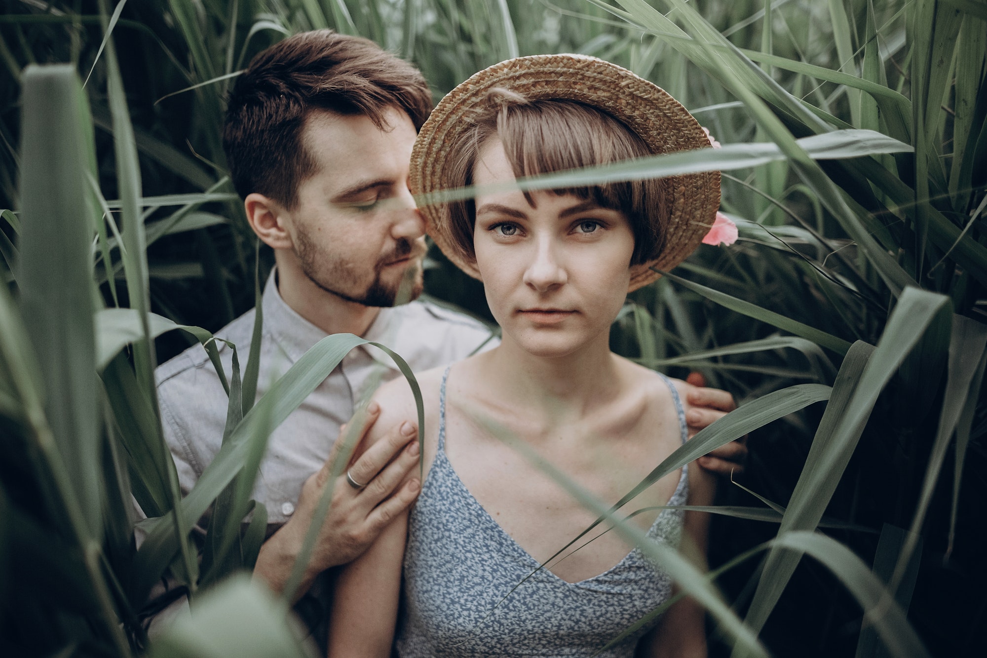 stylish rustic bride and groom embracing in windy high reed.jpg