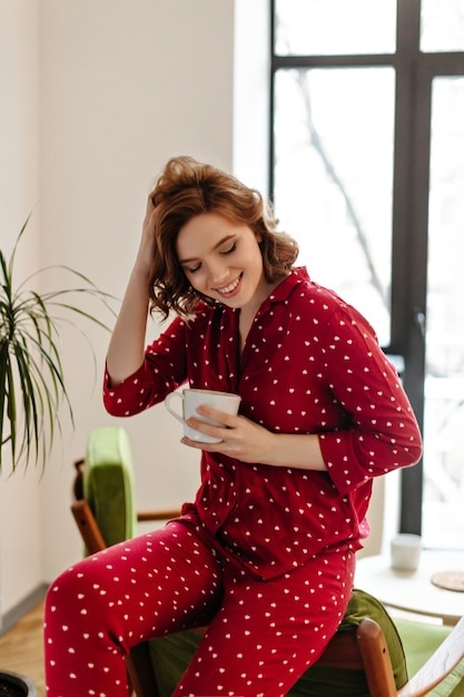 pretty woman red pajama sitting